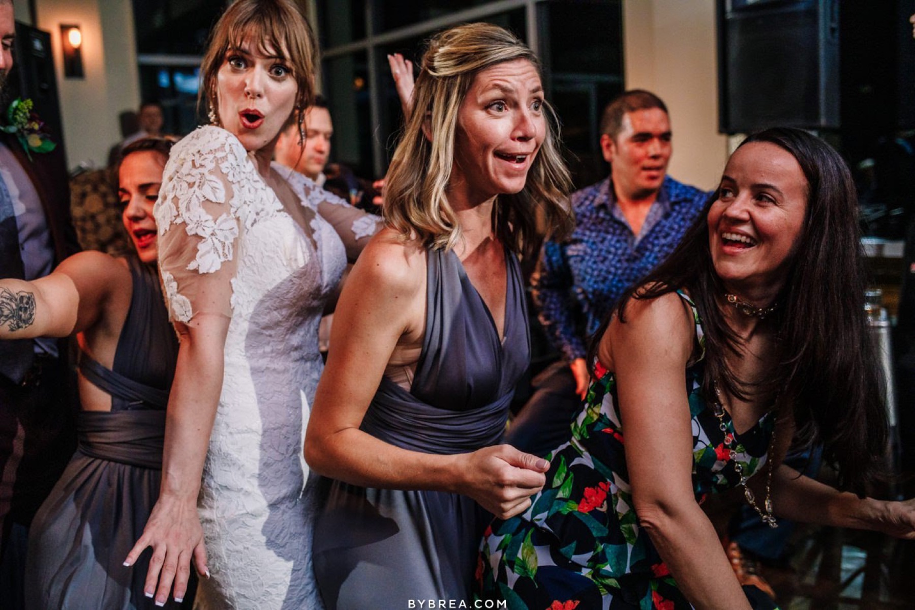 Bridesmaids cheering on the dance floor