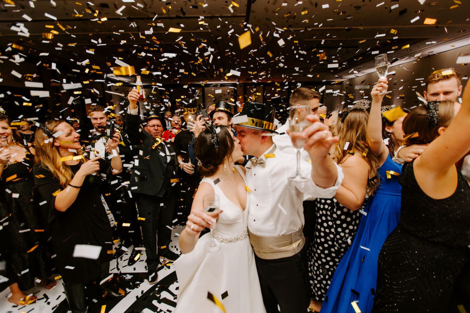 Confetti falling over newlyweds