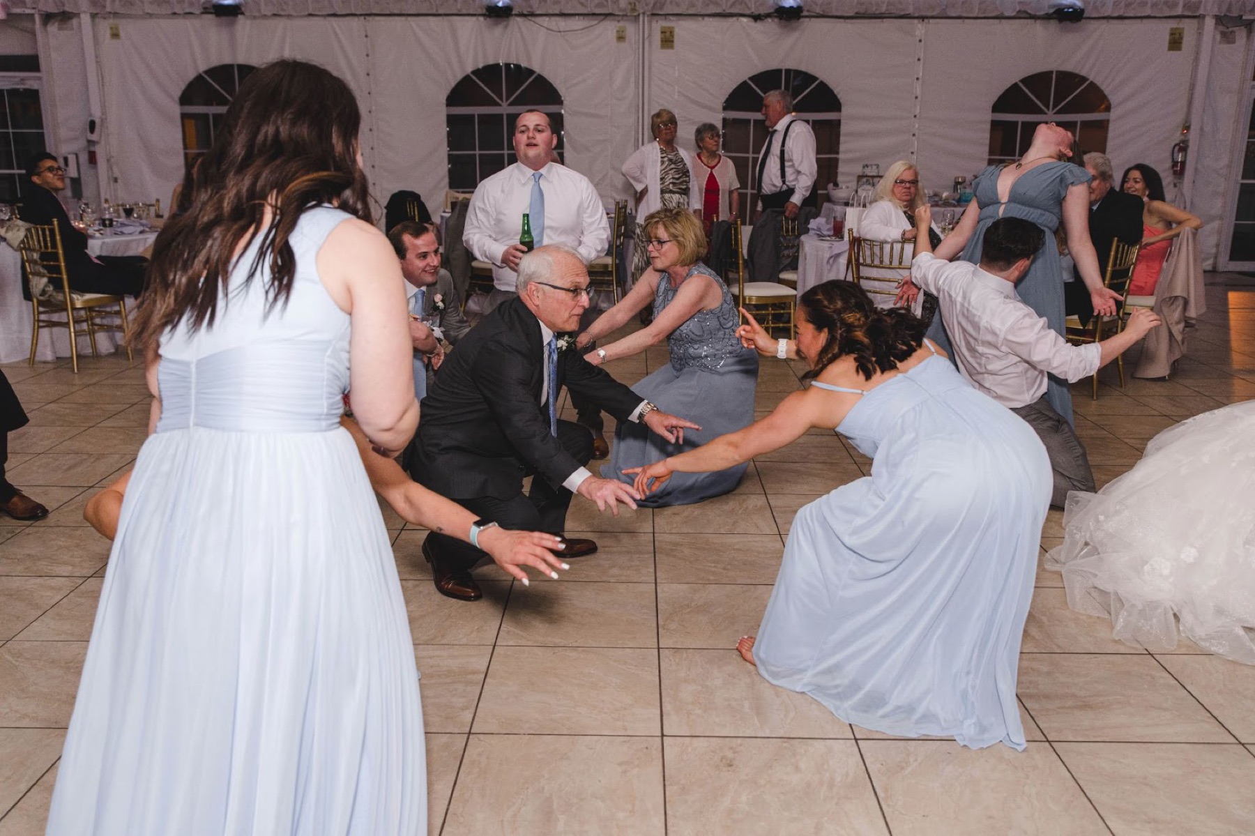 A bride and her guests on the dance floor